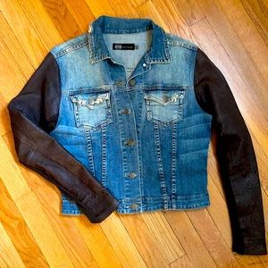 Comfy Jean Jacket with brown leather sleeves.